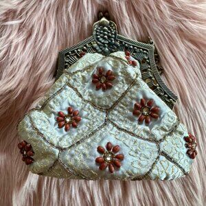 White and Brown Floral Clutch with Ornate Metal Frame